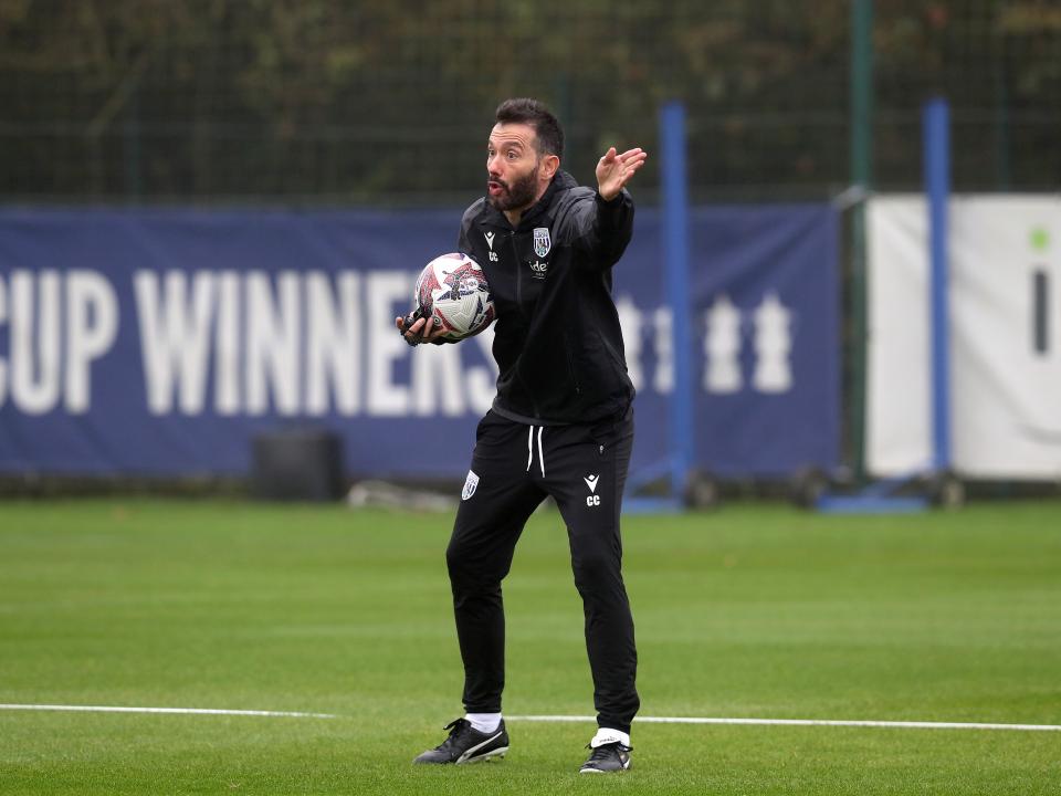 Carlos Corberán delivering instructions to his players during a training session 