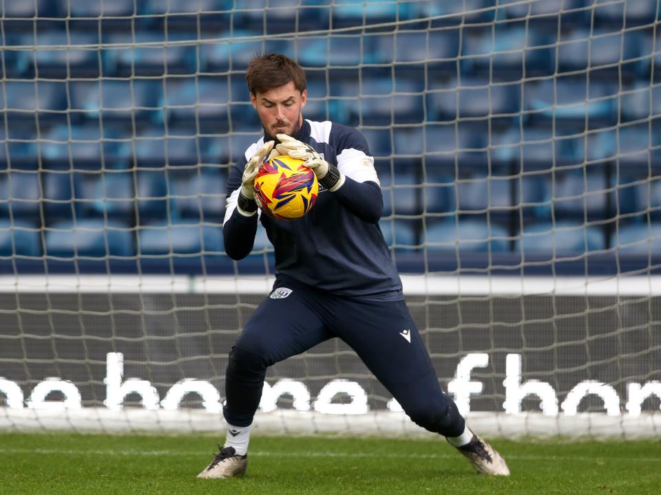 Joe Wildsmith catching a ball during a training session at The Hawthorns