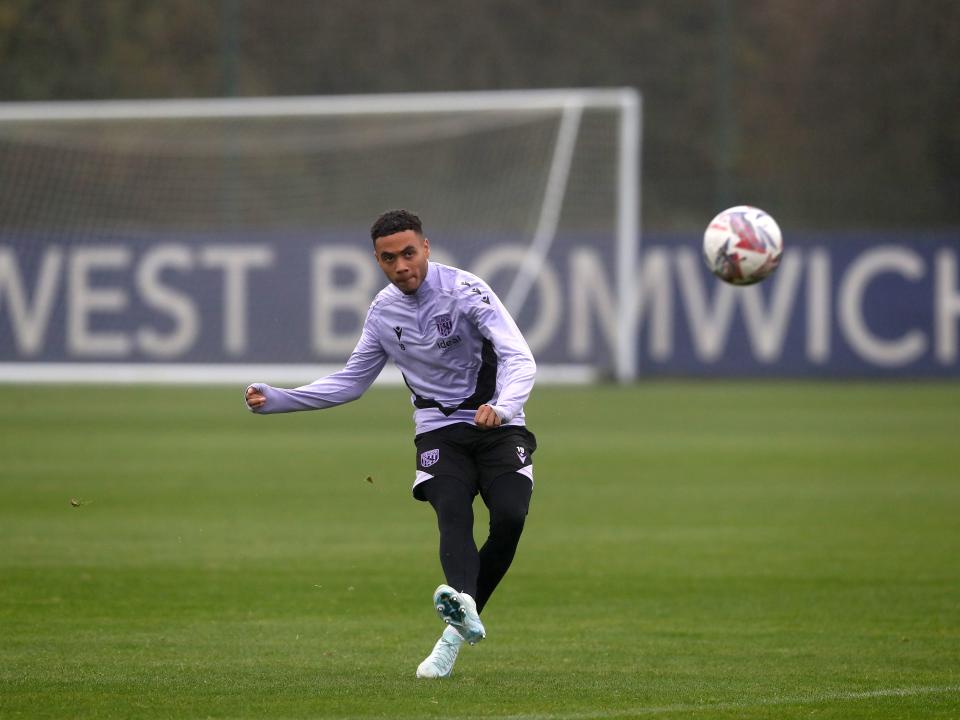 Lewis Dobbin striking the ball during a training session 