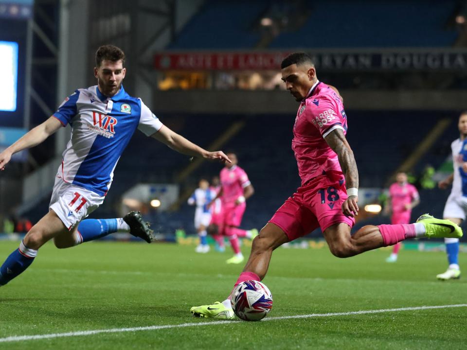 An image of Karlan Grant crossing a ball against Blackburn