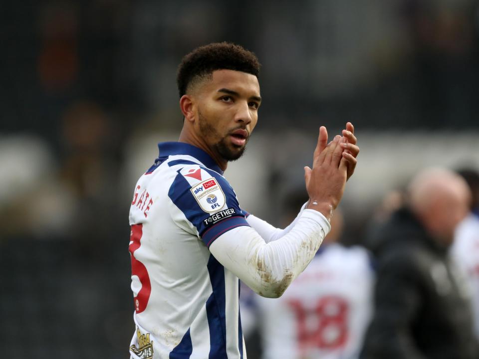 Mason Holgate applauds Albion fans at full-time at Hull