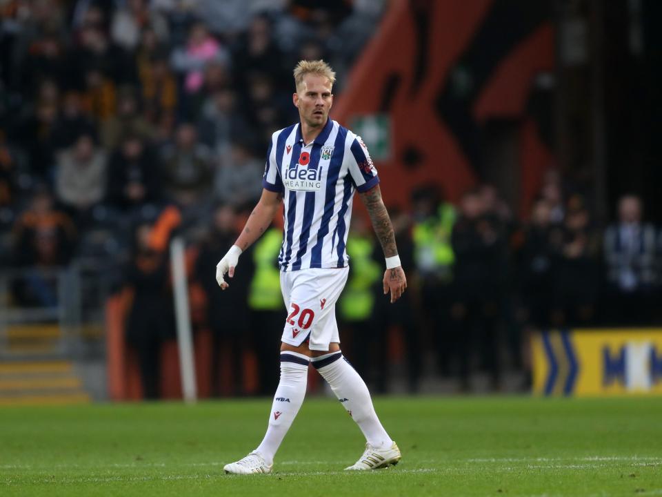 Uroš Račić watching play during the game against Hull