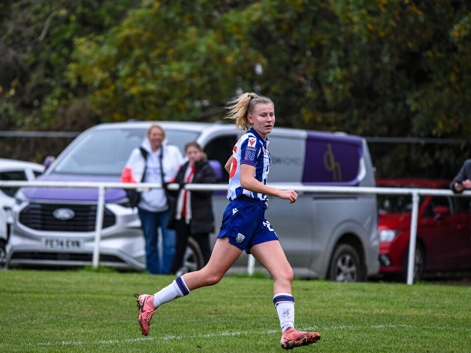 Izzie Whittick in action for Albion Women, in home colours.