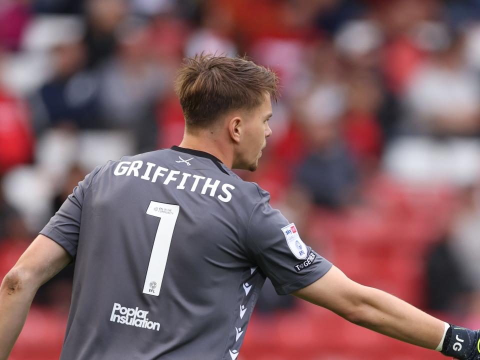 Josh Griffiths in action for Bristol Rovers with his name and No.1 on the back of his shirt 