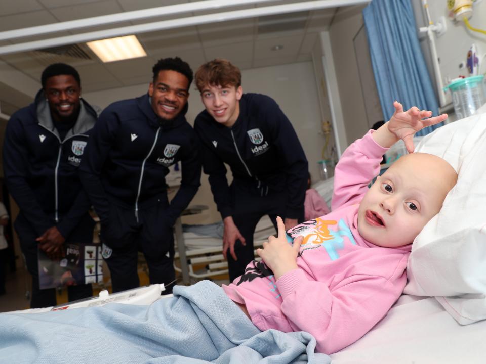 Albion players pose for a photo with a young patient at Midlands Metropolitan University Hospital 
