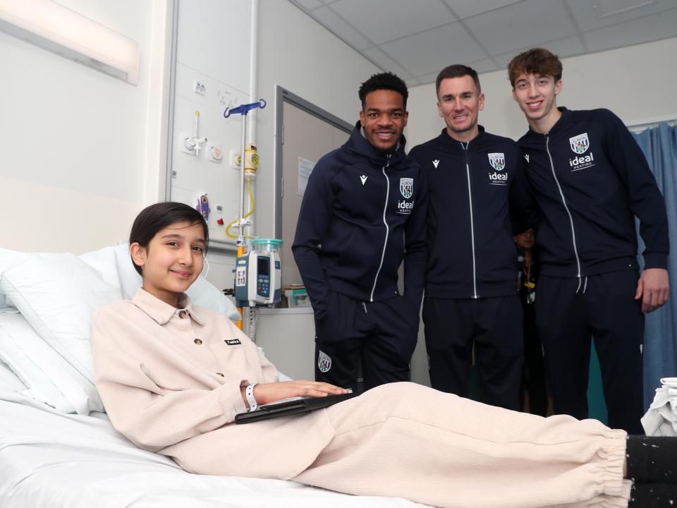 Albion players pose for a photo with a young patient at Midlands Metropolitan University Hospital 