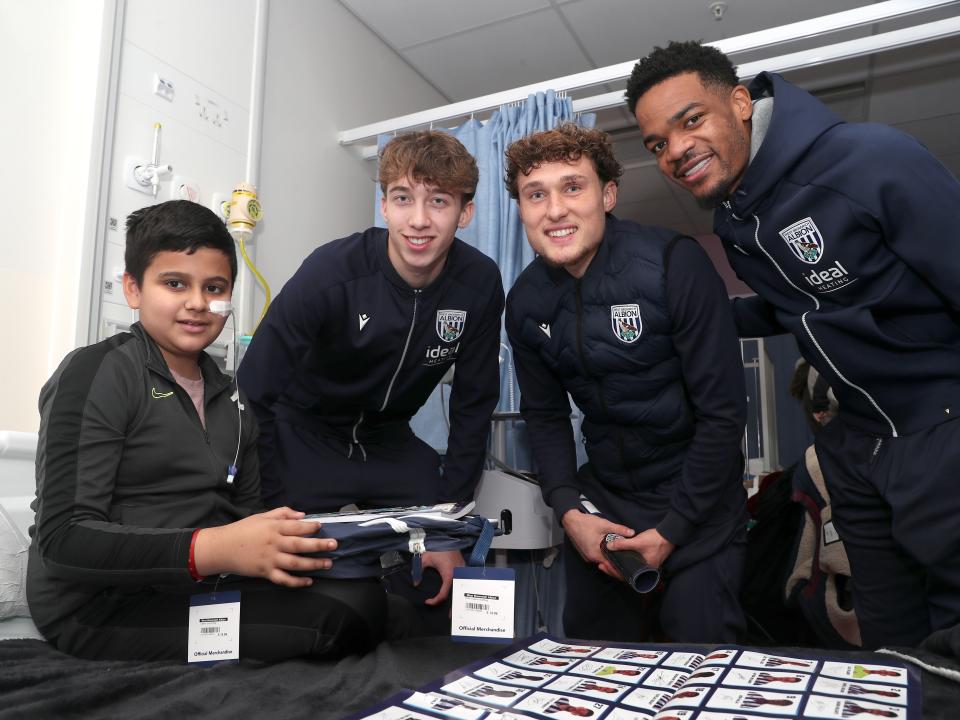Albion players pose for a photo with a young patient at Midlands Metropolitan University Hospital 