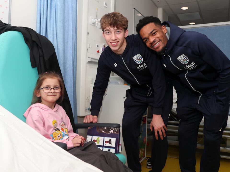 Albion players pose for a photo with a young patient at Midlands Metropolitan University Hospital 