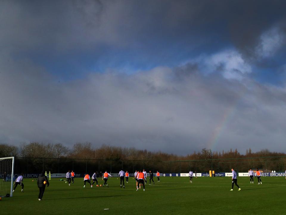 A general view of training with a rainbow in the background 