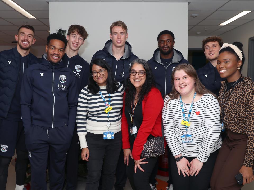 Albion players pose for a photo with NHS staff members at Midlands Metropolitan University Hospital 