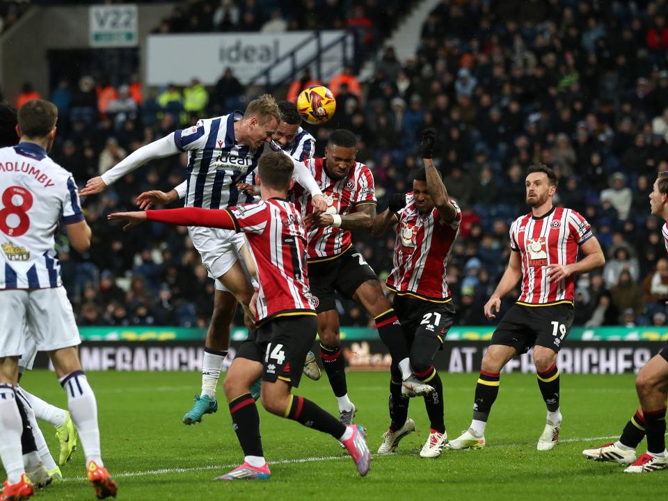 Torbjørn Heggem scores a header against Sheffield United 