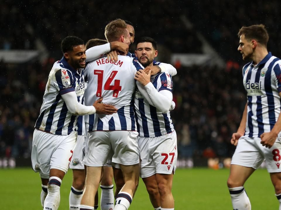 Torbjørn Heggem celebrates scoring a header against Sheffield United with team-mates 