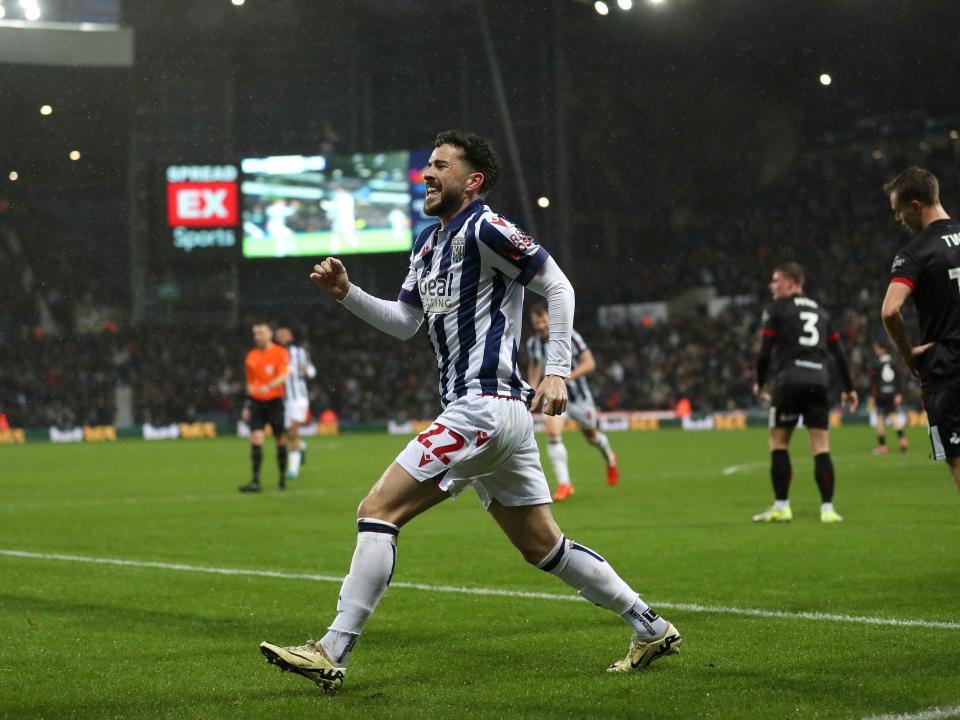 Mikey Johnston celebrates scoring a header against Bristol City 