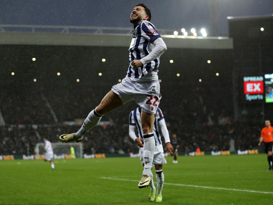Mikey Johnston celebrates scoring a header against Bristol City 