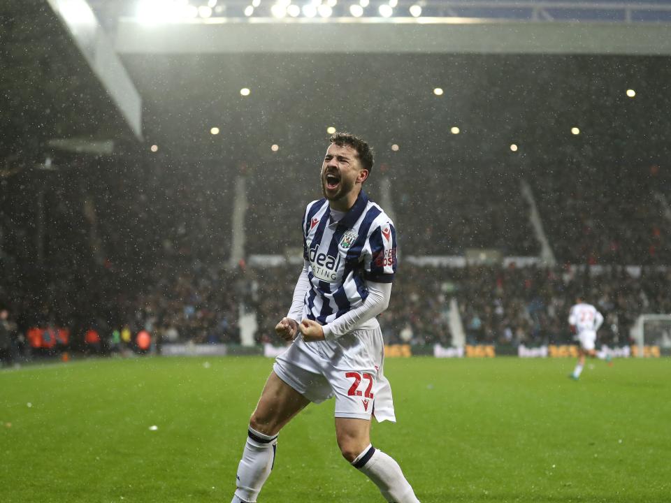Mikey Johnston celebrates scoring a header against Bristol City 