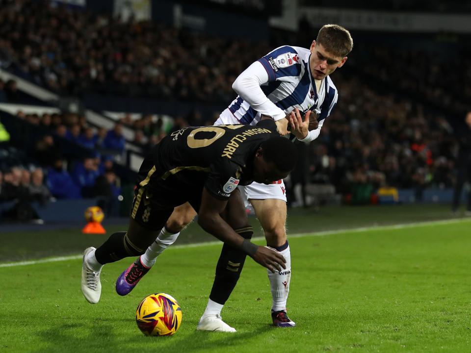 Tom Fellows challenging a Coventry City player 