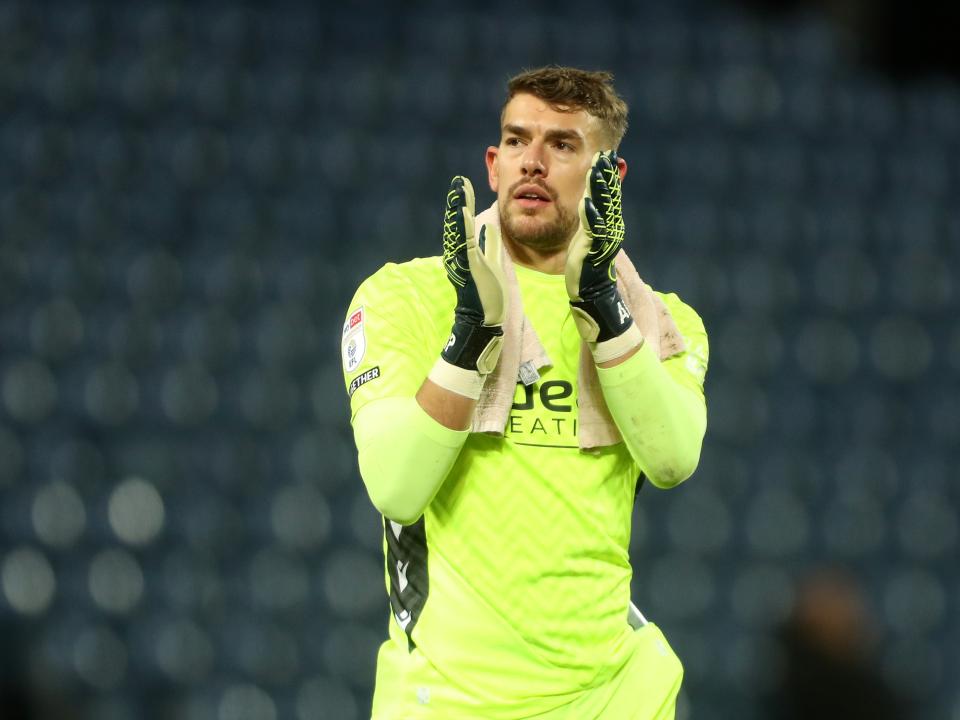 Alex Palmer applauds Albion fans following the win over Bristol City