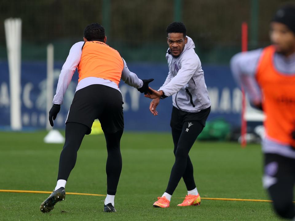 Grady Diangana and Kyle Bartley shake hands during training 
