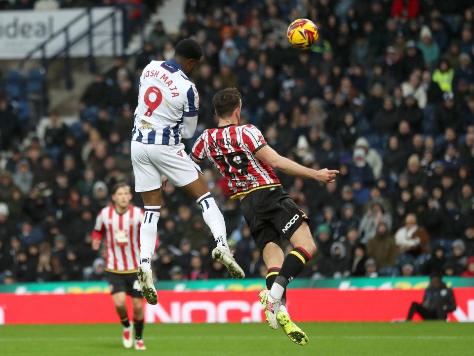 Josh Maja jumps to try and win a header against Sheffield United 
