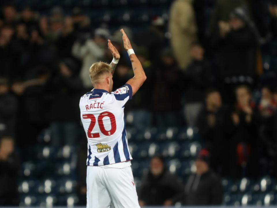Uroš Račić applauds supporters after Albion's win against Coventry City 