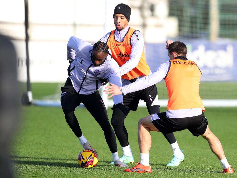 Devante Cole on the ball during training closely watched by Mason Holgate and Jayson Molumby 