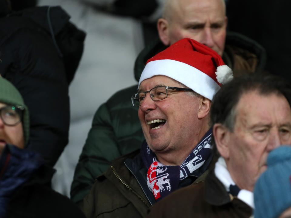 Albion fan with a Santa hat on in the crowd at The Hawthorns against Bristol City