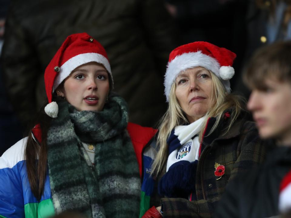 Albion fan with a Santa hat on in the crowd at The Hawthorns against Bristol City