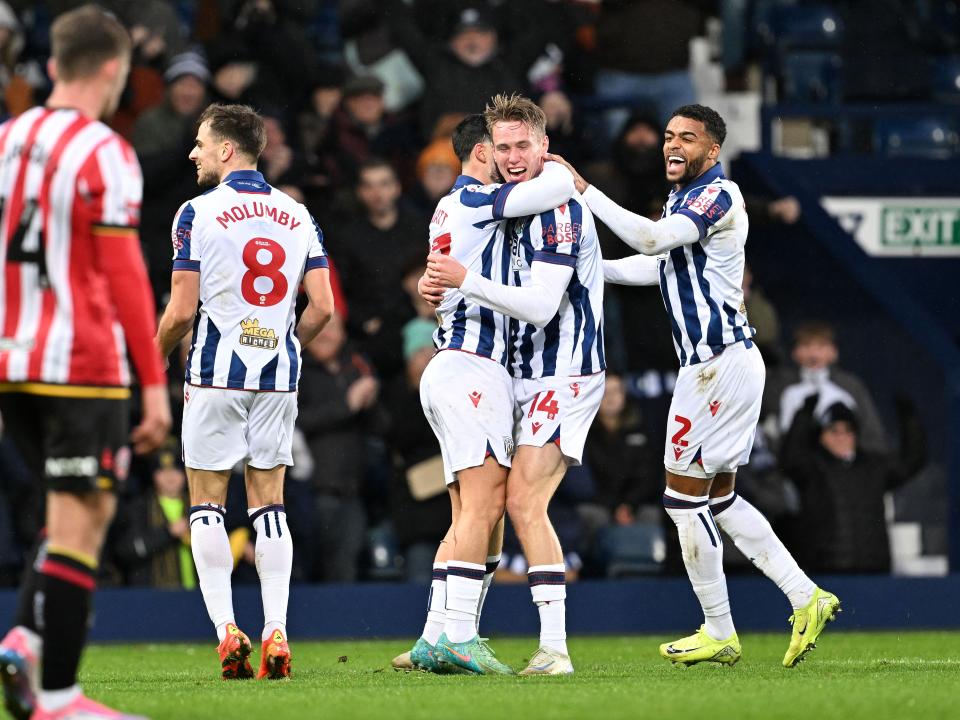 Torbjørn Heggem celebrates scoring a header against Sheffield United with team-mates 
