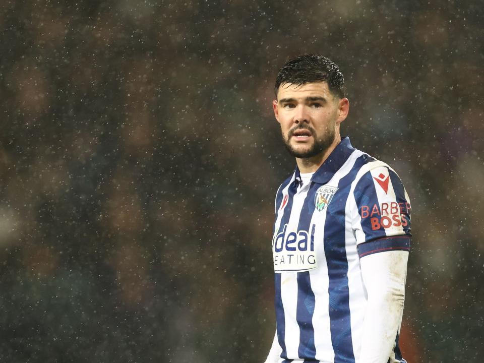 Alex Mowatt in action in the rain against Bristol City 