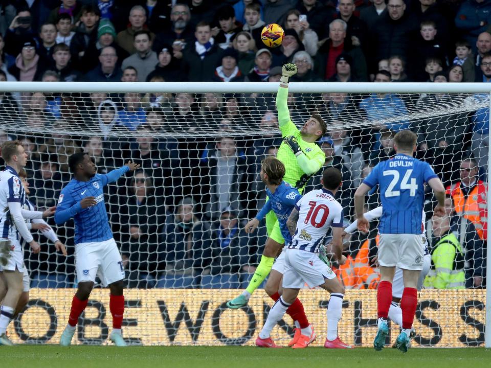 Alex Palmer punching the ball against Portsmouth 