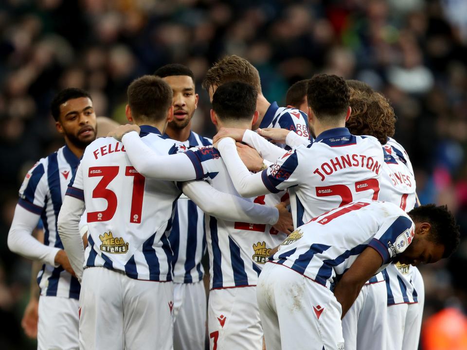 Alex Mowatt celebrates with team-mates after scoring against Portsmouth