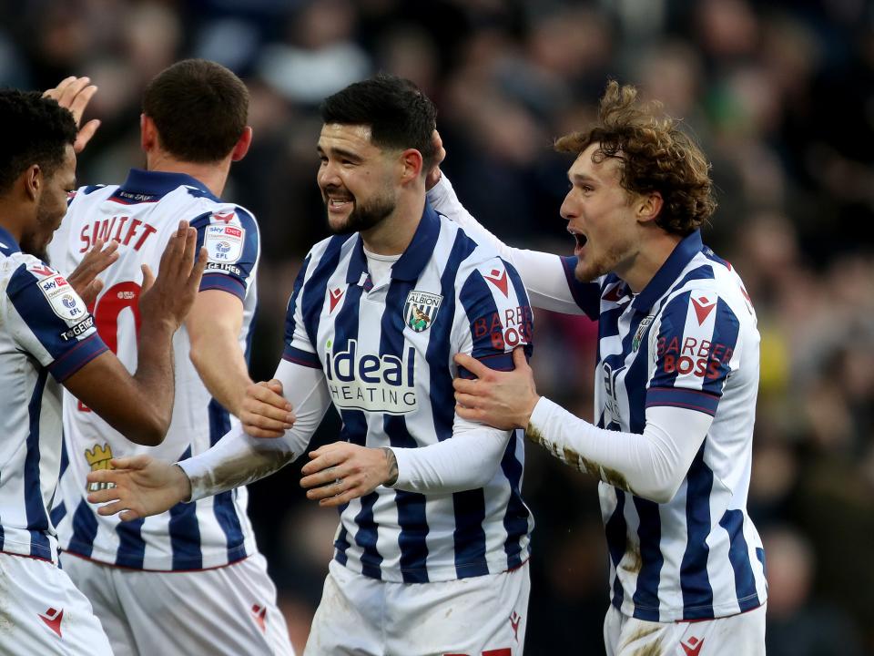 Alex Mowatt celebrates with team-mates after scoring against Portsmouth