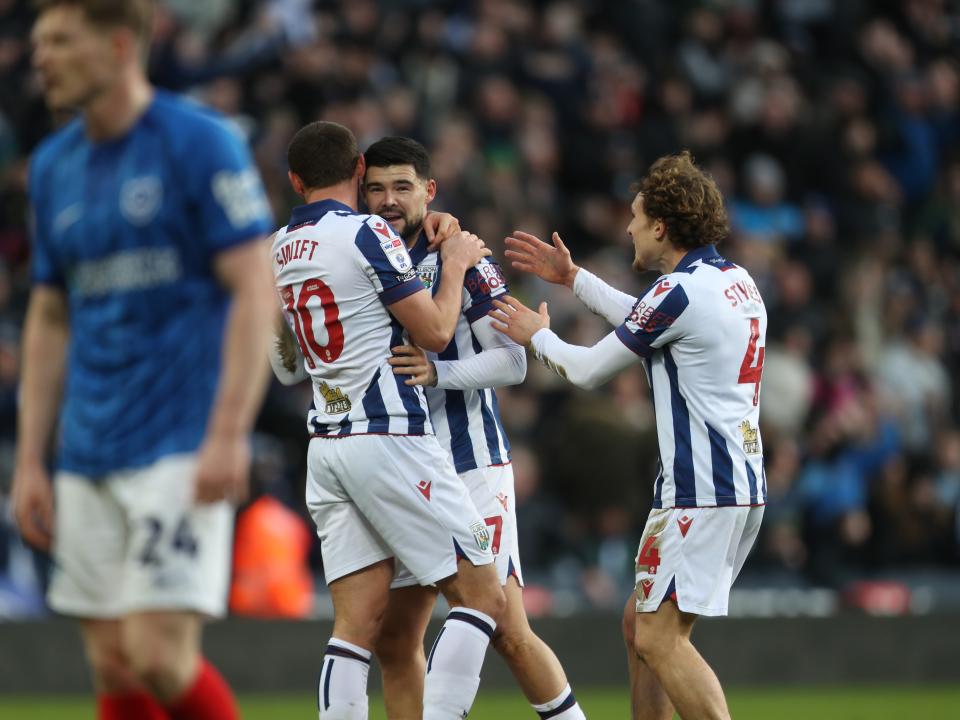 Alex Mowatt celebrates with John Swift and Callum Styles after scoring against Portsmouth