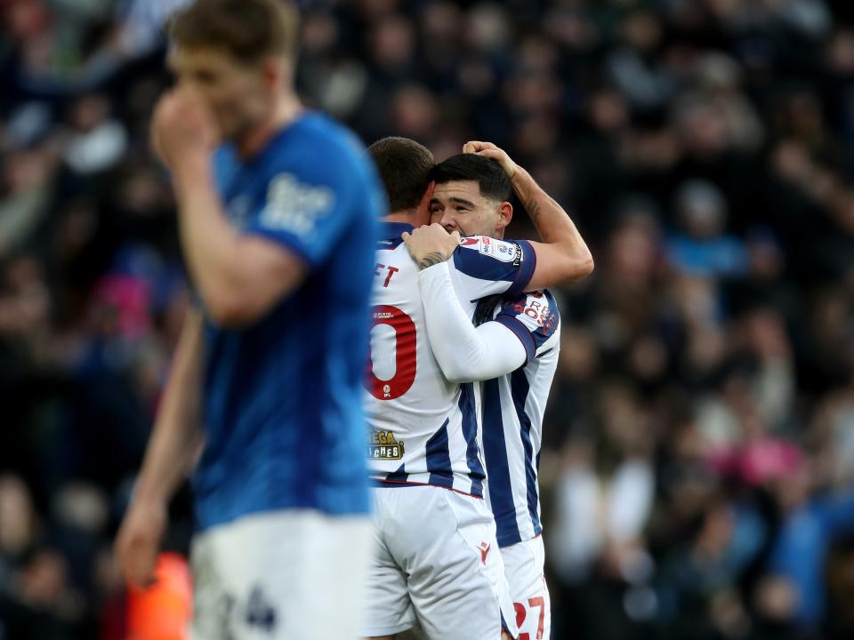 Alex Mowatt celebrates with John Swift after scoring against Portsmouth