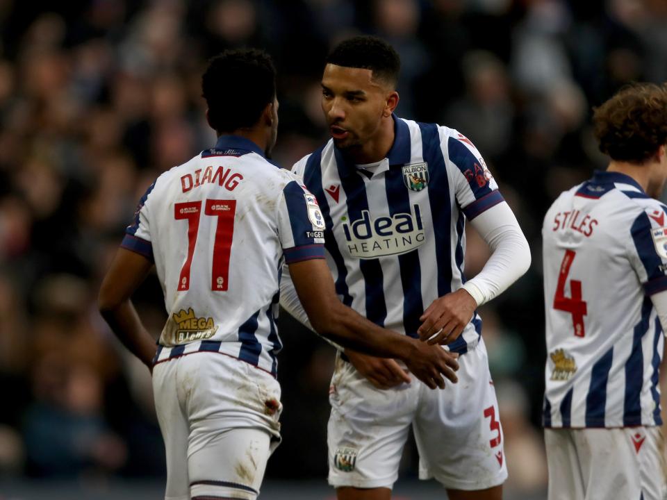 Grady Diangana celebrates with Mason Holgate after scoring against Portsmouth