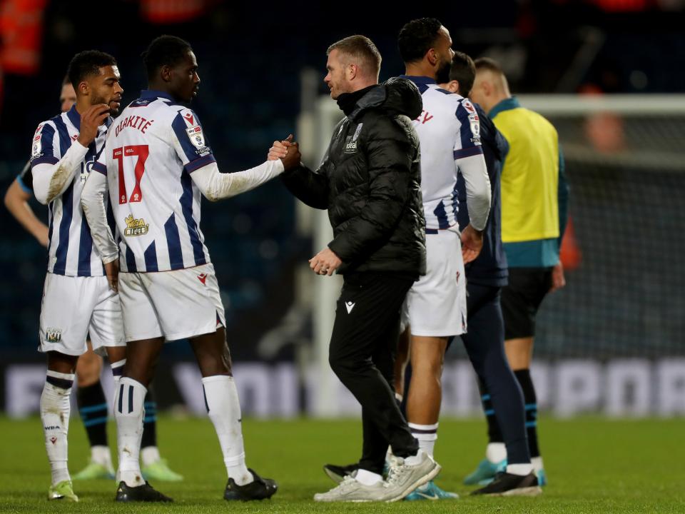 Chris Brunt shaking hands with Ousmane Diakité after the win over Preston