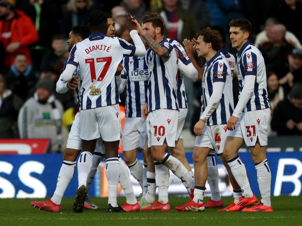 John Swift celebrates scoring against Portsmouth with team-mates