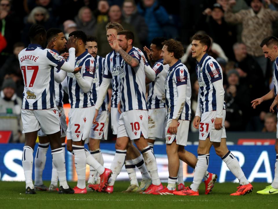 John Swift celebrates scoring against Portsmouth with team-mates
