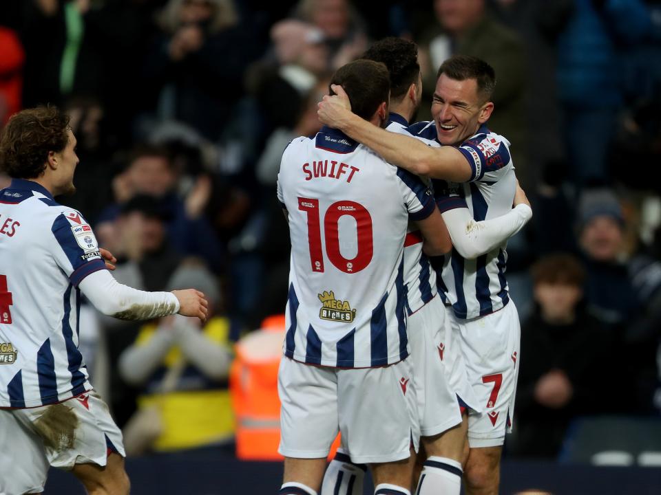 John Swift celebrates scoring against Portsmouth with Jed Wallace