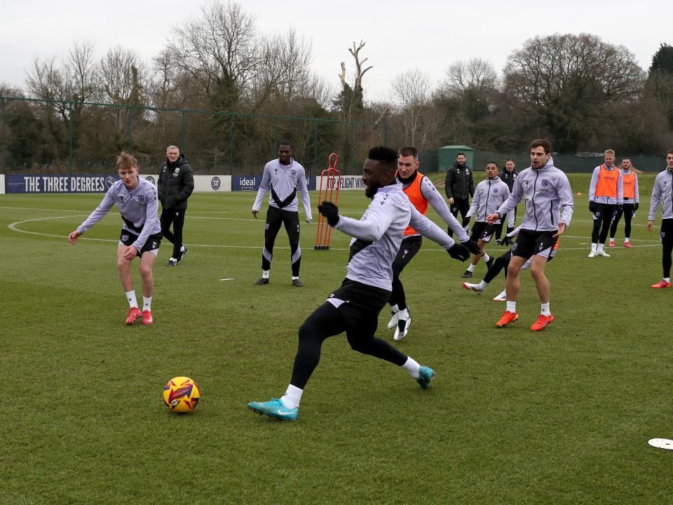 A general view of a training session with Tony Mowbray watching in the background