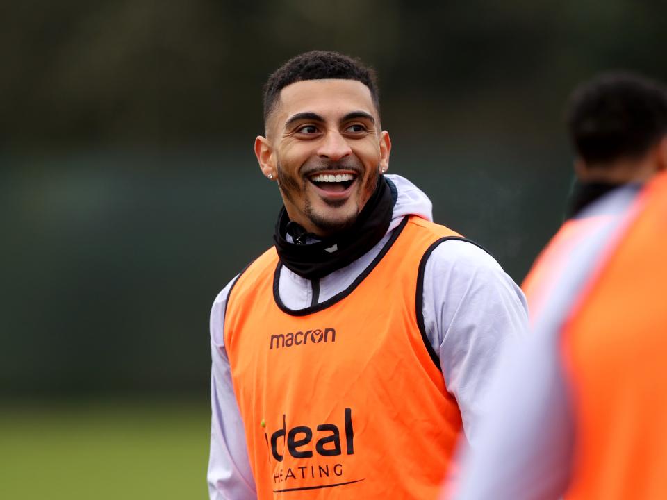 Karlan Grant laughing during a training session