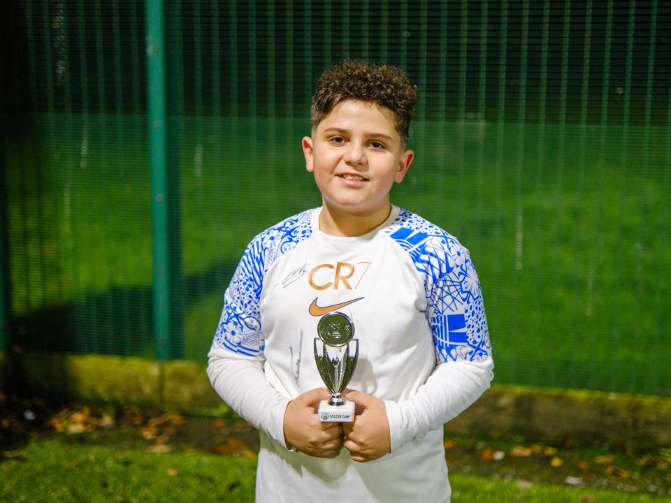 Cezar poses with his trophy.