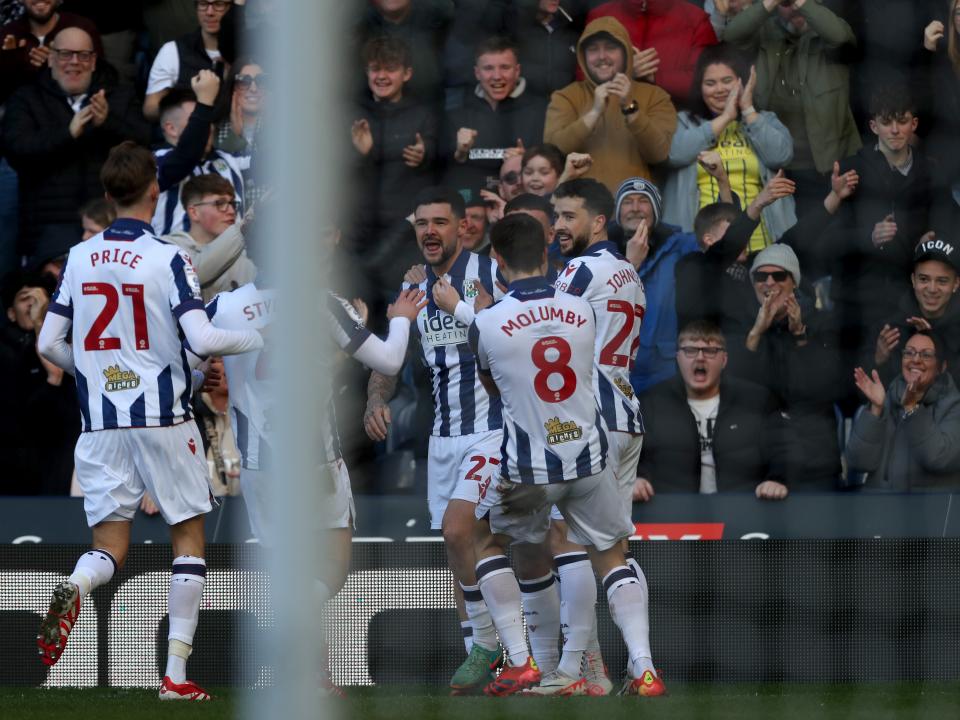 Alex Mowatt celebrates scoring against Oxford at The Hawthorns with team-mates 