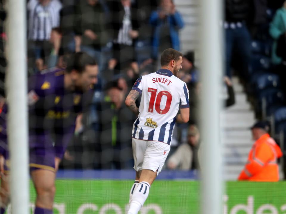 John Swift celebrates scoring against Oxford at The Hawthorns