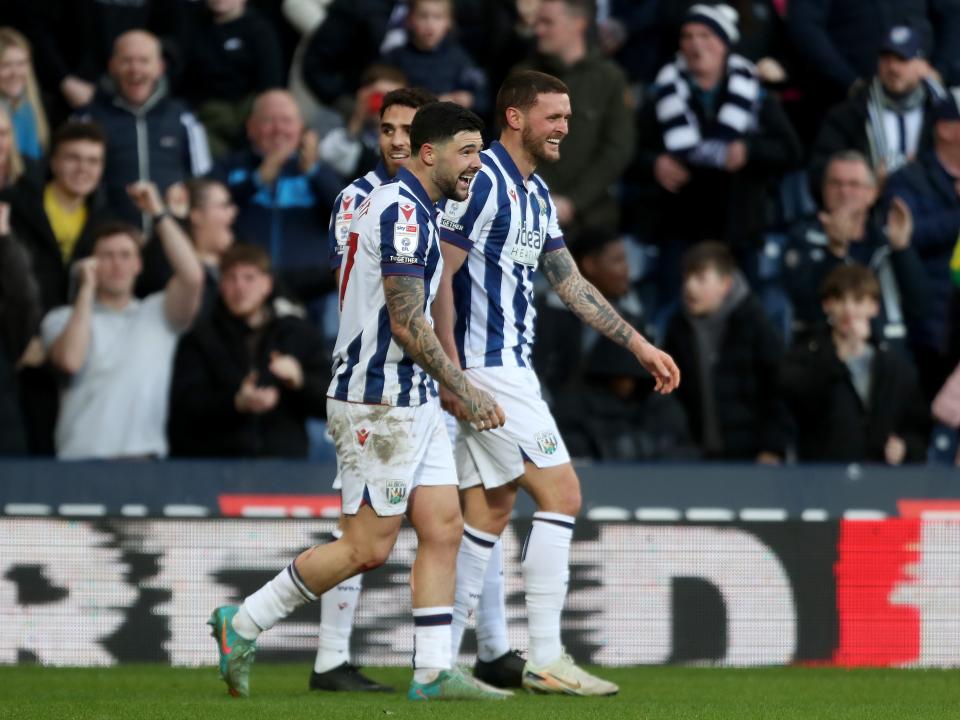 John Swift celebrates scoring against Oxford at The Hawthorns