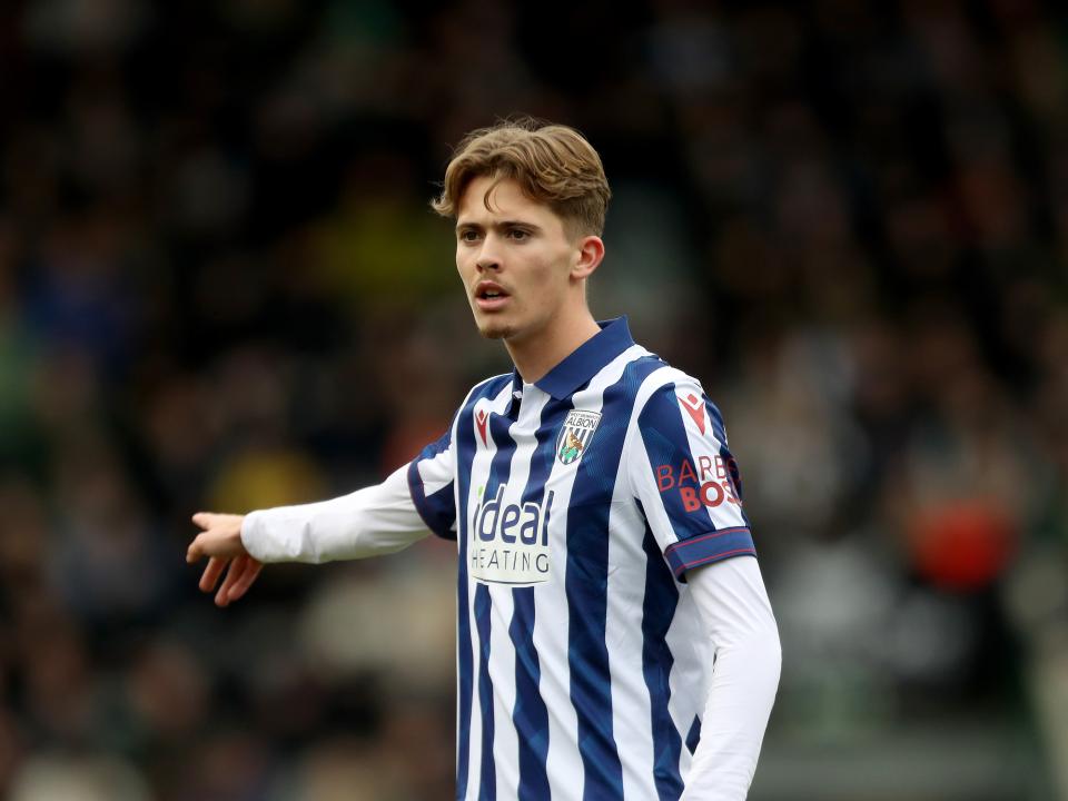 Isaac Price in the home kit pointing during a game
