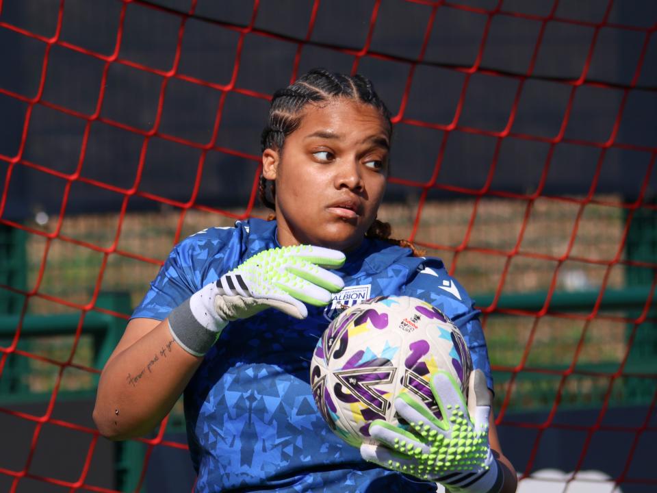 Lavarna Johnson holding a ball during a warm up before a game 