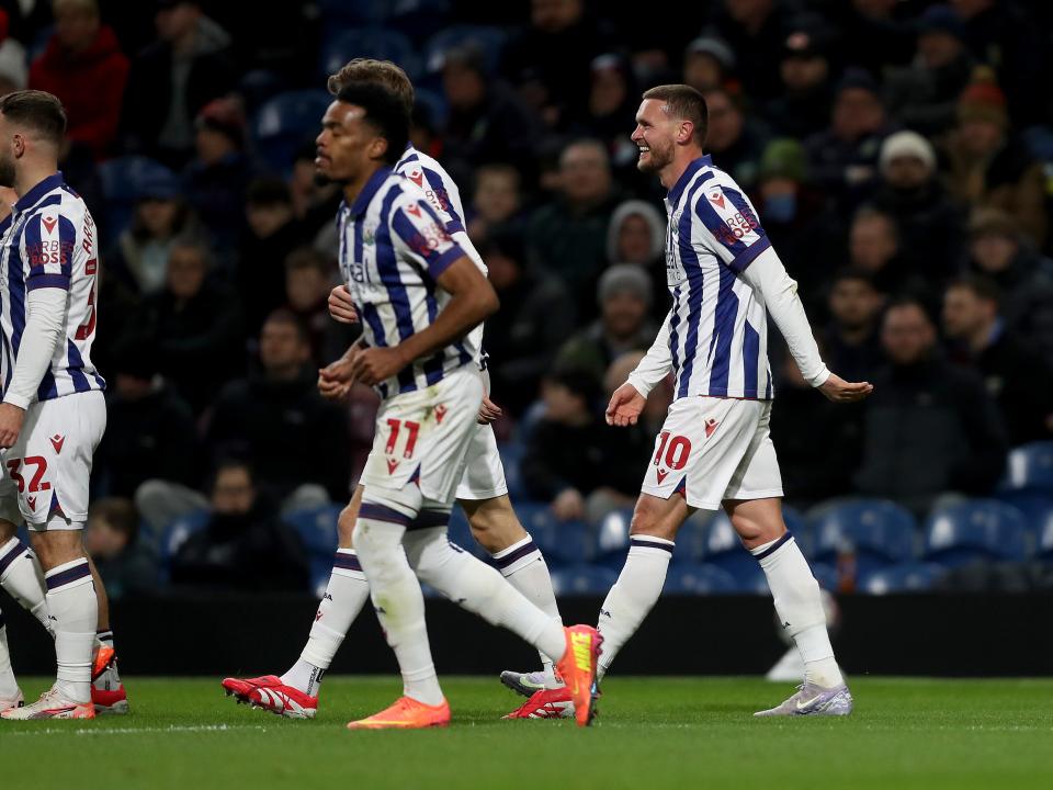 John Swift celebrates scoring a free-kick at Burnley