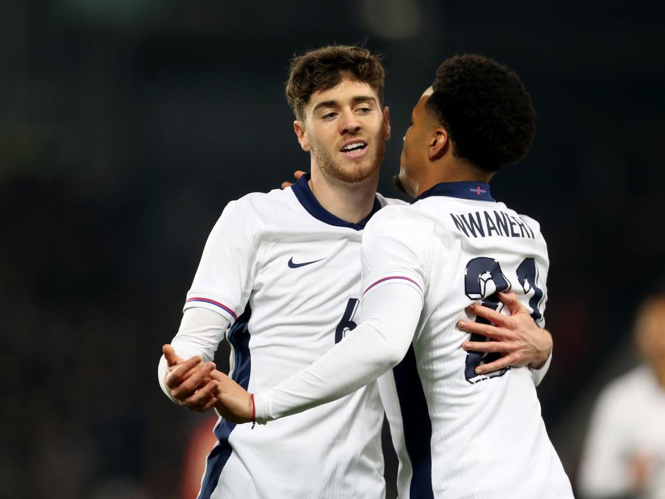 Two England players celebrate a goal scored against Portugal at The Hawthorns