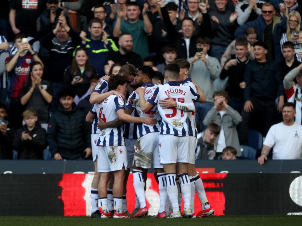 Adam Armstrong is mobbed by team-mates after scoring against QPR 